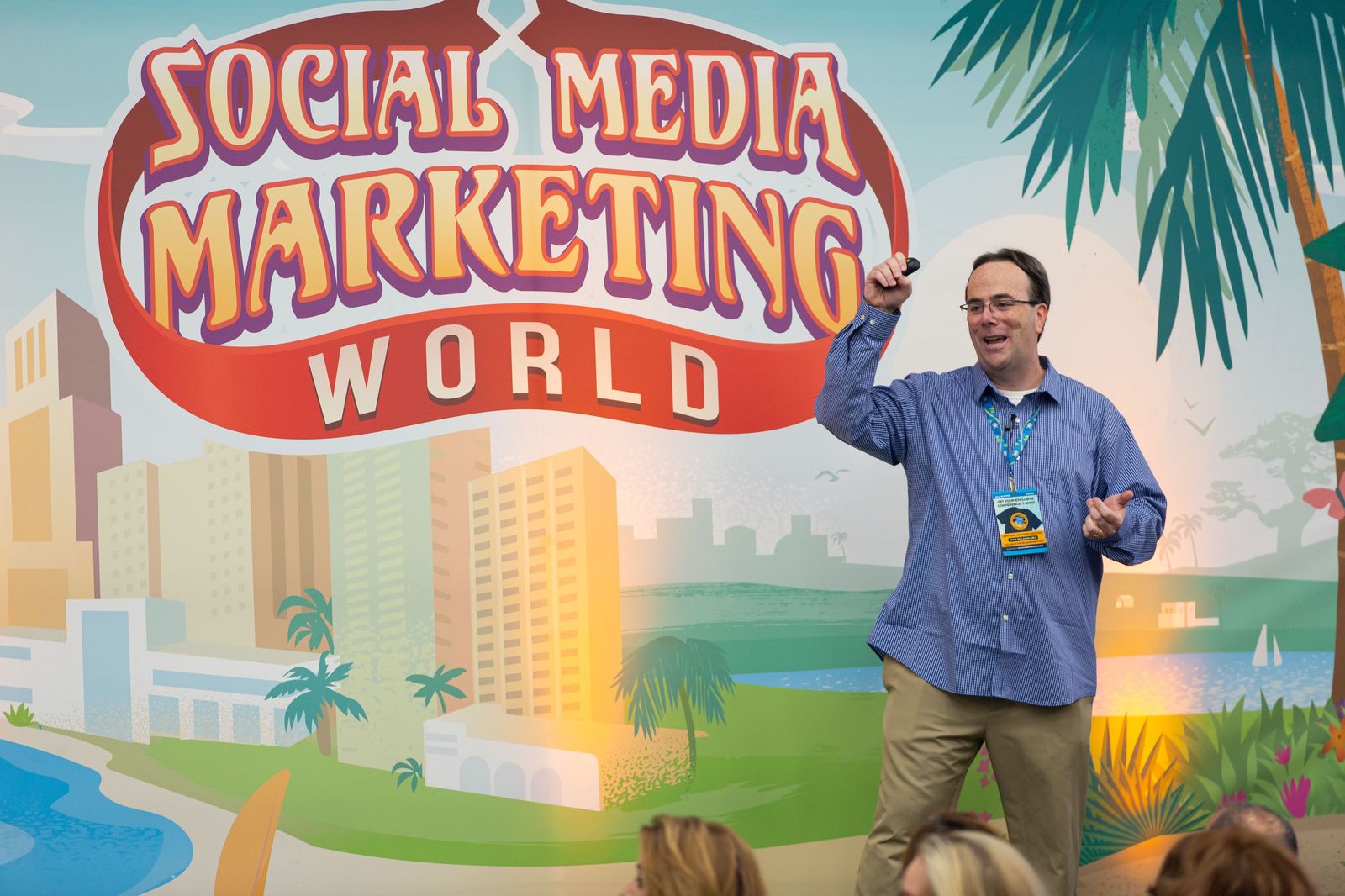 John Nemo on stage at Social Media Marketing World, clicker raised above the crowd